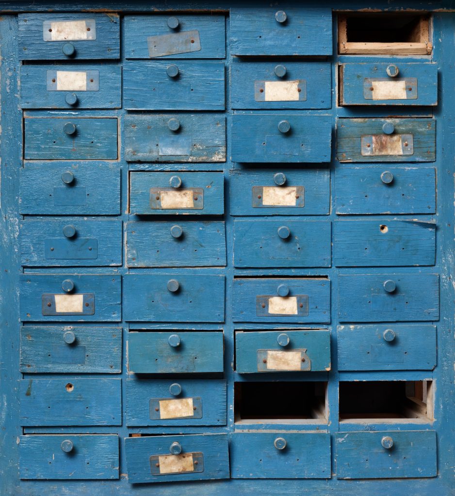 Old blue wooden cabinet with drawers