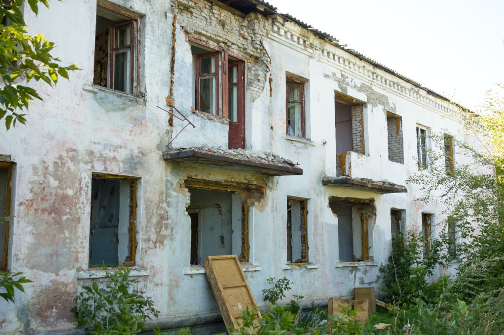 Old two-story brick house for demolition